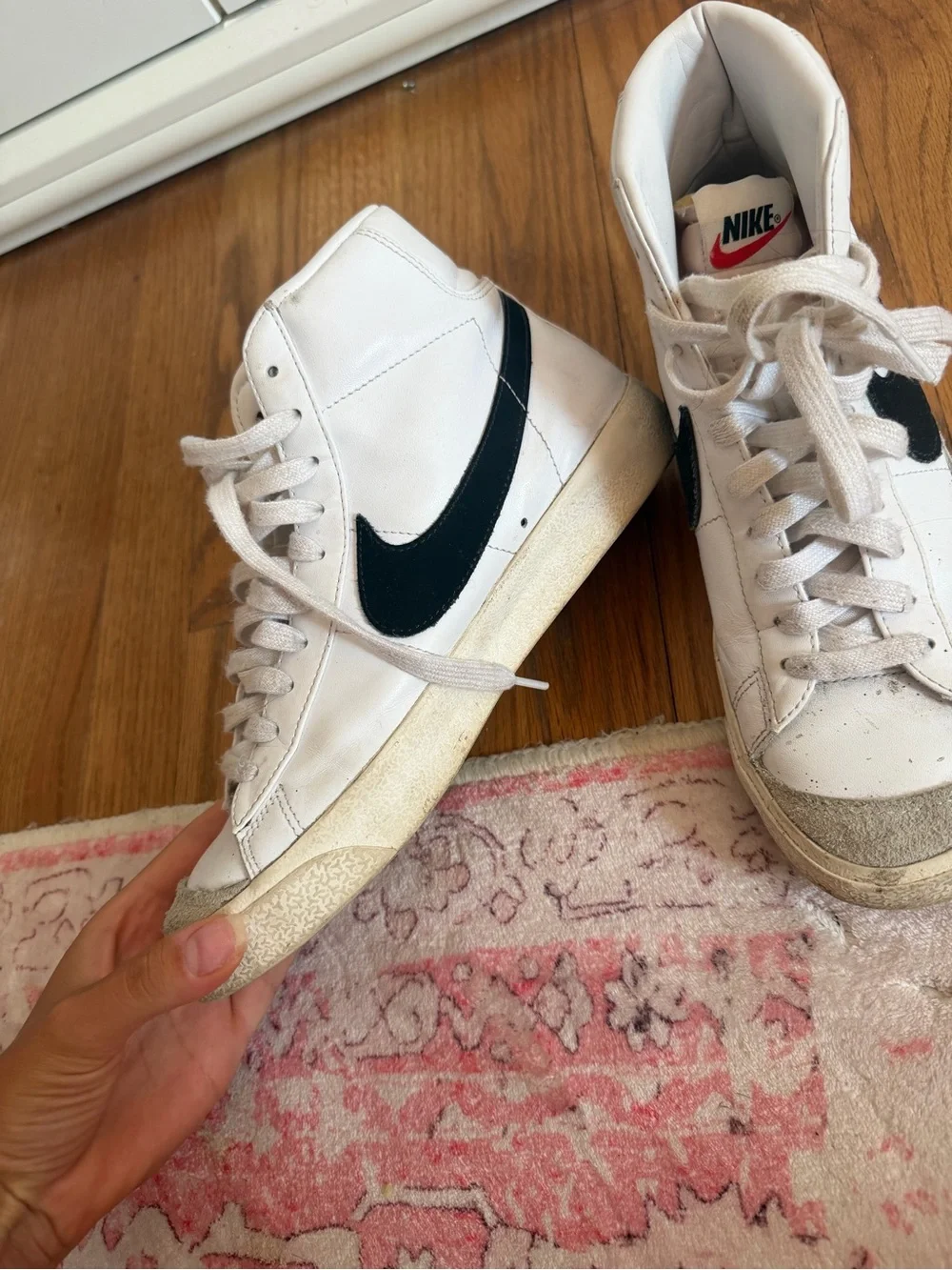 Nike White High-Top Sneakers with Black Swoosh